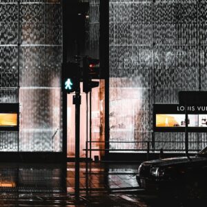 black car parked near gray wall